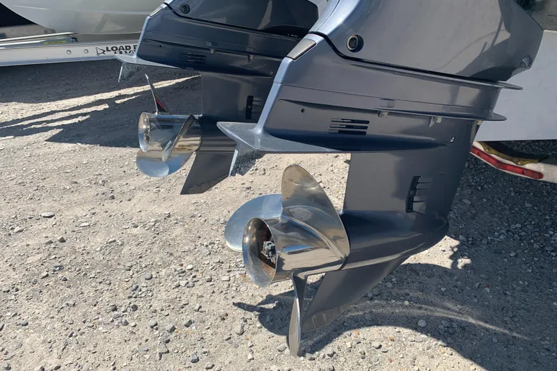 Slide: The Image of Twin outboard motors on a 2018 Sea Hunt Gamefish 27 boat, showcasing propellers. - 22
