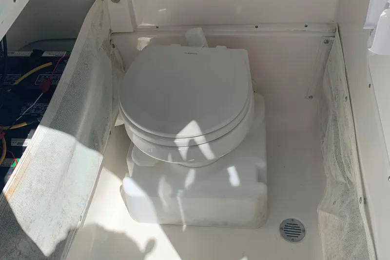 Slide: The Image of Portable toilet in 2018 Sea Hunt Gamefish 27 Forward Seating boat compartment. - 23