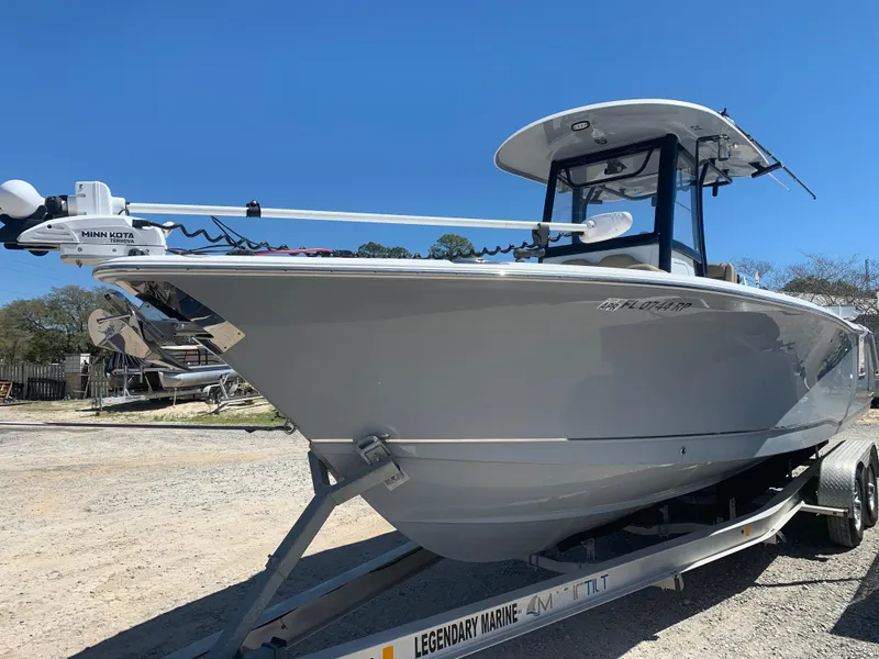 Slide: The Image of 2018 Sea Hunt Gamefish 27 boat on trailer, featuring forward seating and sleek design. - 3