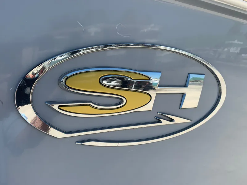 Slide: The Image of Sea Hunt Gamefish 27 logo on 2018 model boat, featuring sleek design and metallic finish. - 5