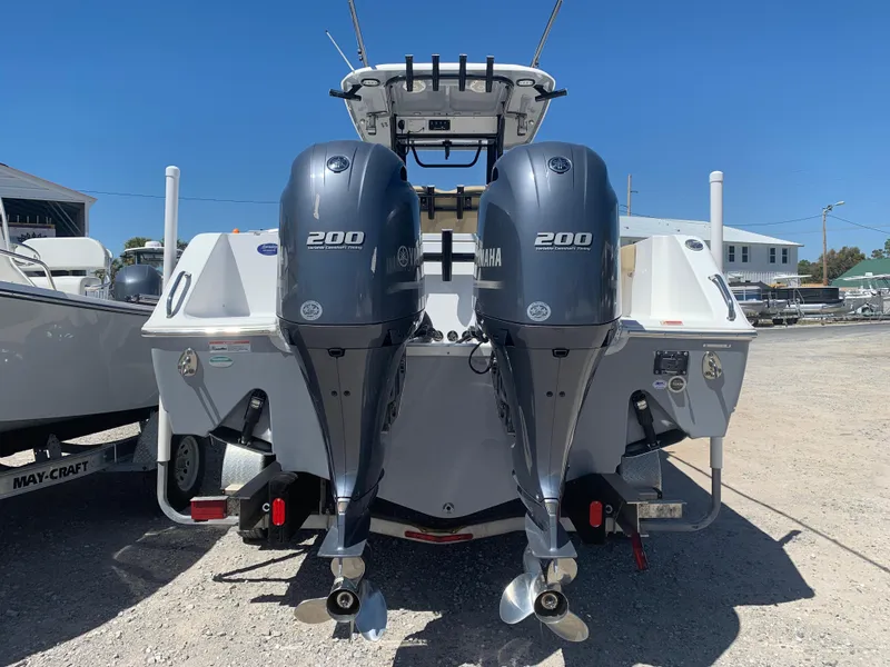 Slide: The Image of 2018 Sea Hunt Gamefish 27 with twin Yamaha 200 engines, parked on a trailer. - 6