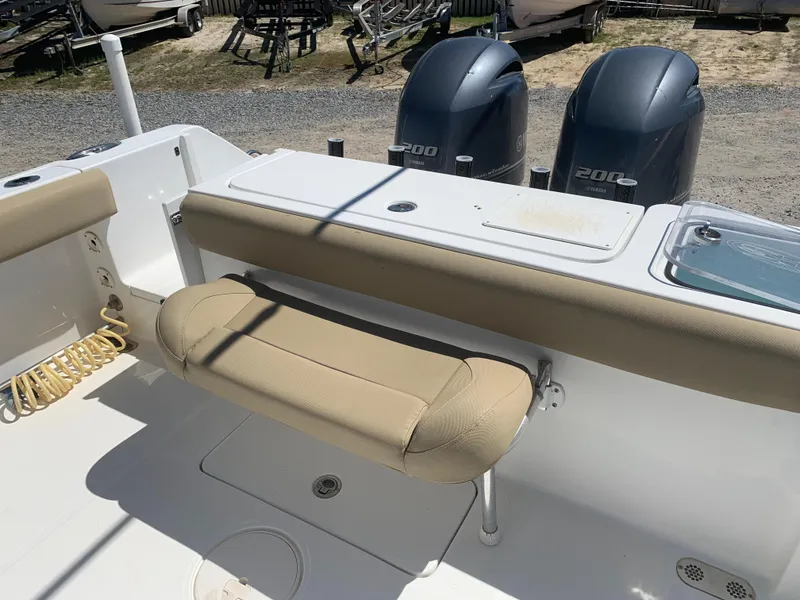 Slide: The Image of 2018 Sea Hunt Gamefish 27 boat interior with seating and dual 200 engines. - 9