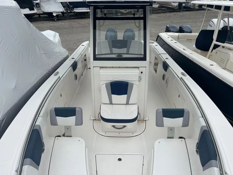Slide: The Image of 2021 Robalo R272 Center Console boat interior with seating and console view. - 13