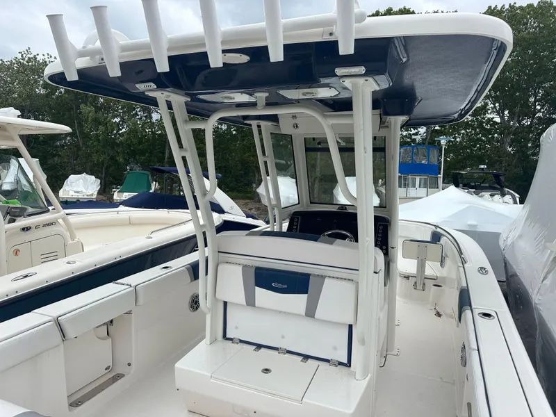 Slide: The Image of 2021 Robalo R272 Center Console boat with T-top and spacious deck. - 7
