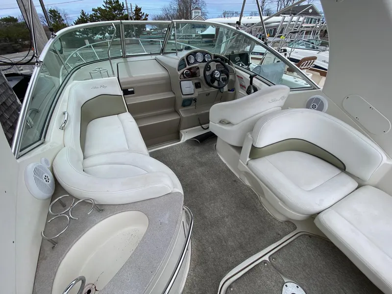 Slide: The Image of 2007 Sea Ray 260 Sundancer boat on trailer under clear blue sky. - 10