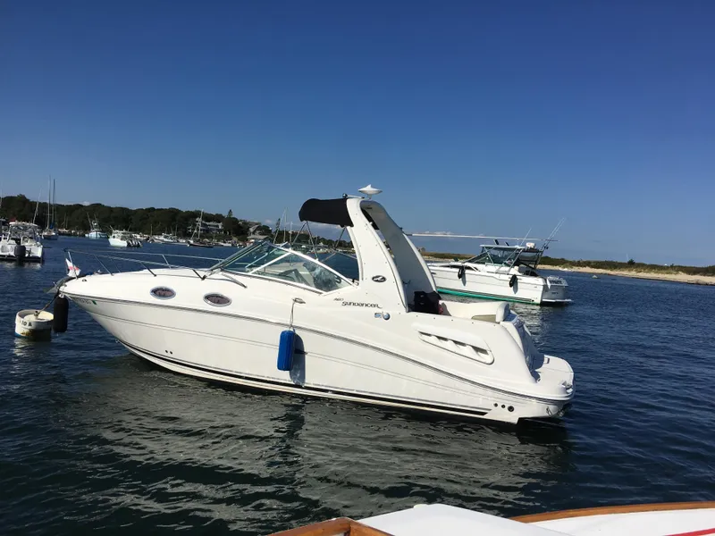 Slide: The Image of Dashboard view of a 2007 Sea Ray 260 Sundancer boat on open water. - 2