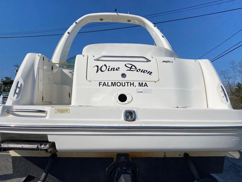 Slide: The Image of 2007 Sea Ray 260 Sundancer docked at marina, side view. - 5