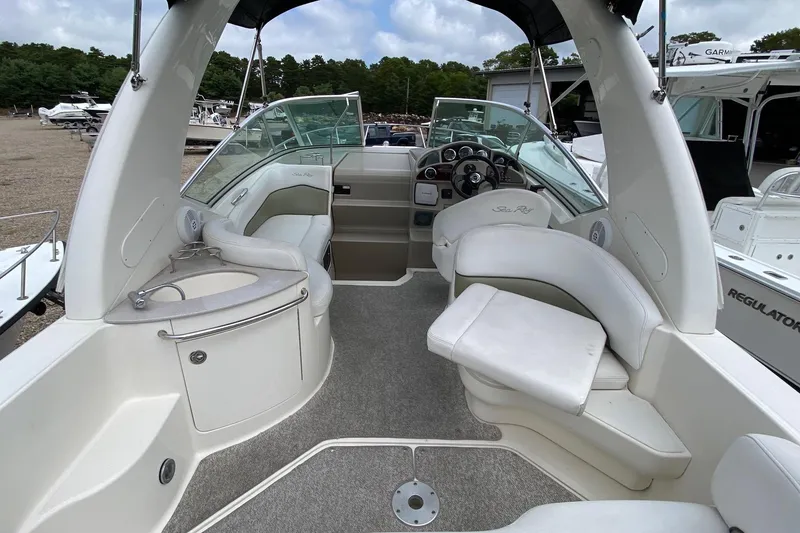 Slide: The Image of 2007 Sea Ray 260 Sundancer boat anchored in a serene harbor. - 8