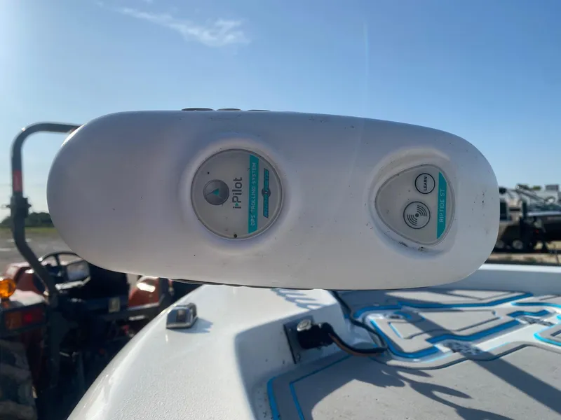 Slide: The Image of Control panel on a 2015 NauticStar 2200 Sport boat under clear blue sky. - 11