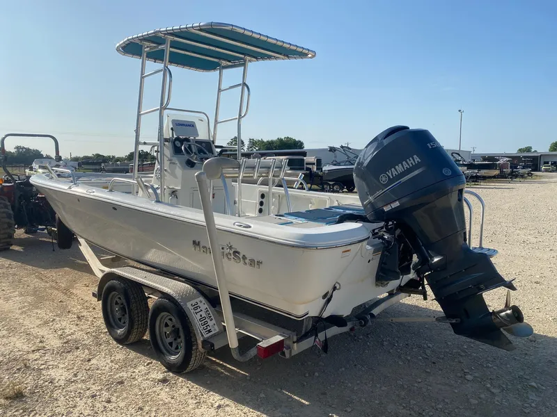Slide: The Image of 2015 NauticStar 2200 Sport boat on trailer with Yamaha outboard motor. - 3
