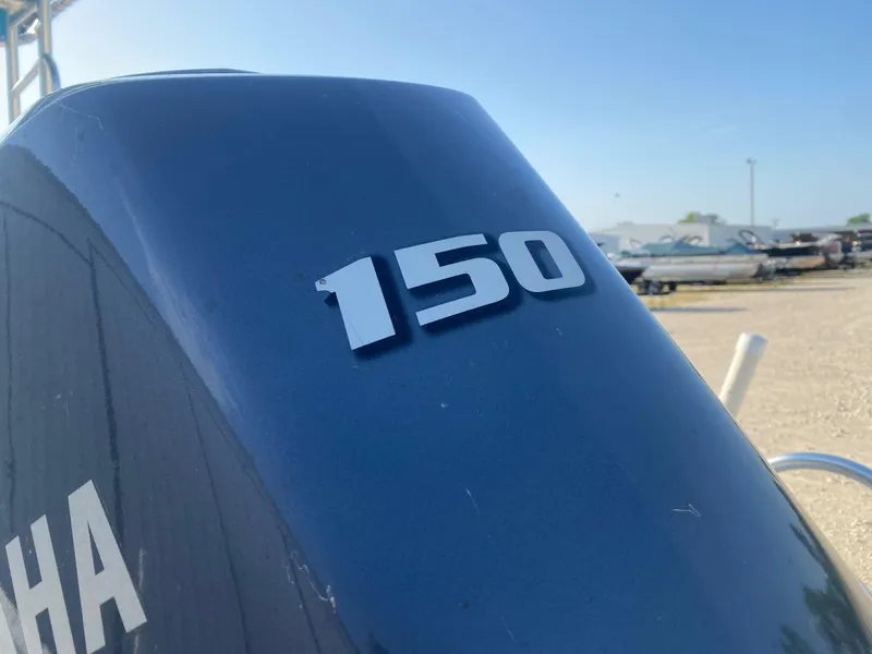 Slide: The Image of Yamaha 150 outboard motor on a 2015 NauticStar 2200 Sport boat. - 4