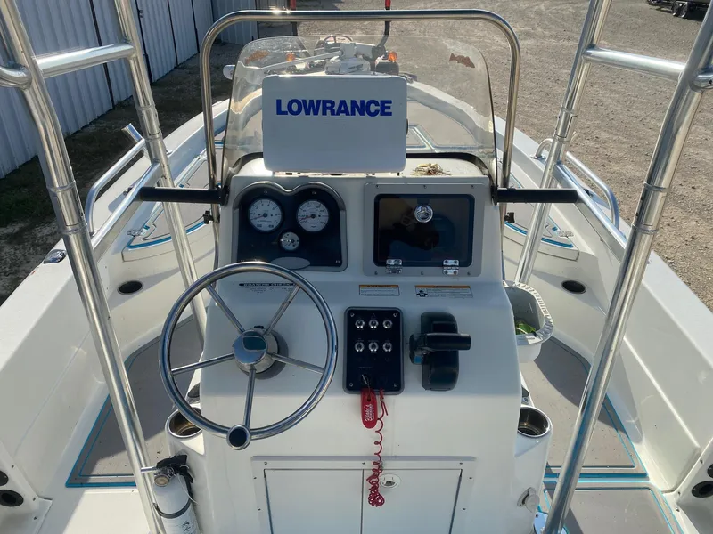 Slide: The Image of 2015 NauticStar 2200 Sport boat dashboard with Lowrance navigation system. - 7