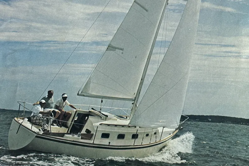 The Image of 1978 Bristol 29.9 sailboat with crew sailing on open water under clear skies. - 0