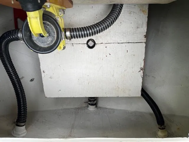 Slide: The Image of 1978 Bristol 29.9 boat interior showing plumbing and mechanical components. - 16