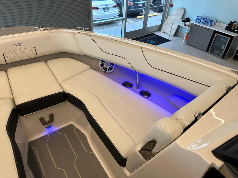 Slide: The Image of Luxurious interior of 2025 Regal LX6 boat with ambient blue lighting. - 10