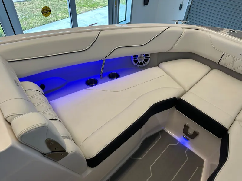 Slide: The Image of 2025 Regal LX6 boat interior with luxurious seating and modern design. - 11