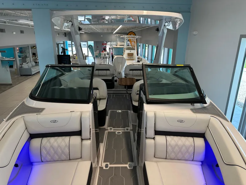 Slide: The Image of 2025 Regal LX6 boat interior with luxurious seating and integrated speakers. - 12