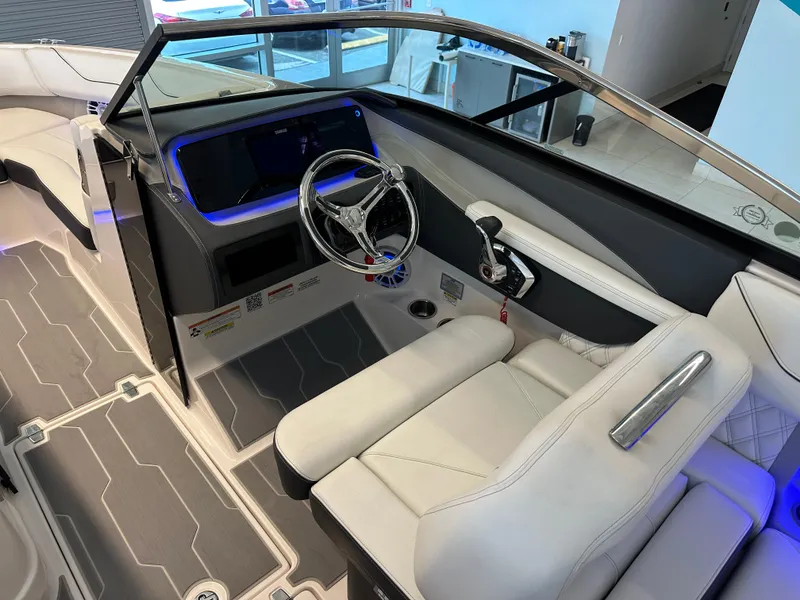Slide: The Image of 2025 Regal LX6 boat interior with modern dashboard and luxurious seating. - 5