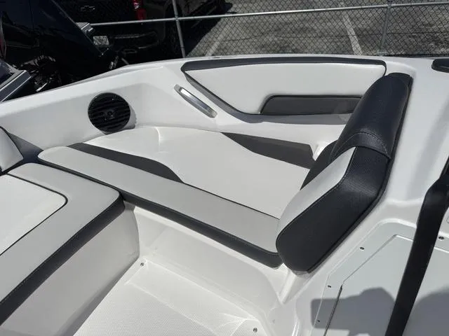 Slide: The Image of 2024 Yamaha Boats 195S interior seating with sleek design and modern upholstery. - 10