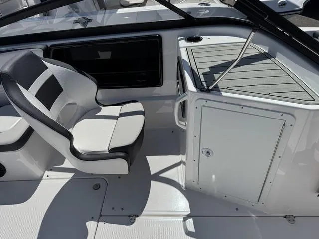 Slide: The Image of 2024 Yamaha Boats 195S interior, featuring sleek seating and modern dashboard design. - 15