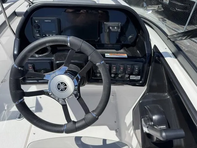 Slide: The Image of 2024 Yamaha Boats 195S dashboard with steering wheel and control panel. - 19