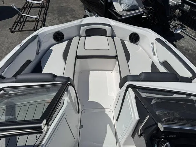 Slide: The Image of 2024 Yamaha Boats 195S interior, featuring sleek seating and modern design. - 9