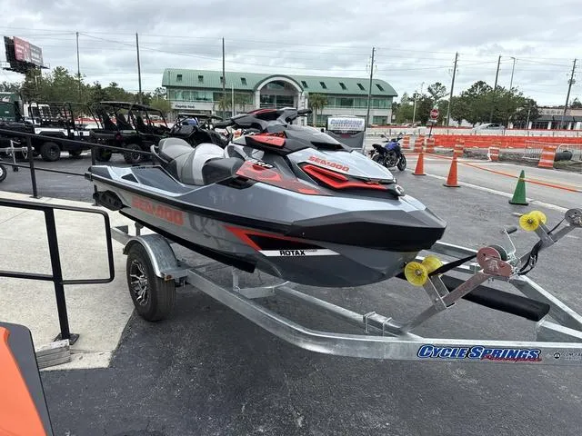 Slide: The Image of 2018 Sea-Doo Waverunner PW RXT-X 300 on trailer, parked outdoors. - 11