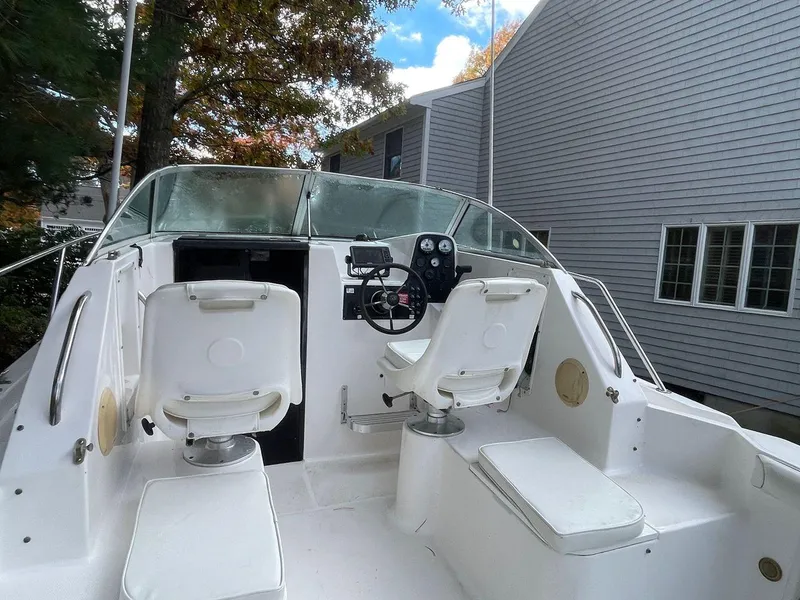 Slide: The Image of 1998 Wellcraft 210 Coastal boat interior with seating and steering wheel. - 9