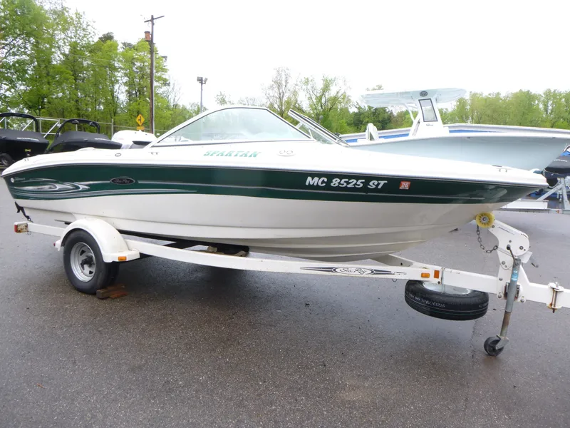Slide: The Image of 2005 Sea Ray 185 Sport boat on trailer, parked outdoors. - 2
