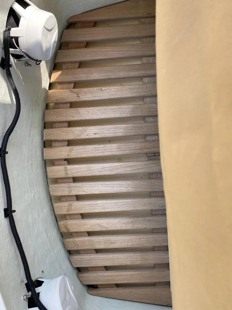 Slide: The Image of Wooden interior of 2005 Roth Bilt 21 Classic boat with speakers and wiring. - 10