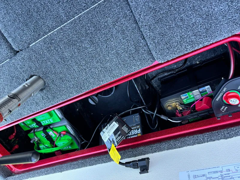 Slide: The Image of 2020 Ranger Z185 boat battery compartment with wiring and Interstate batteries. - 11