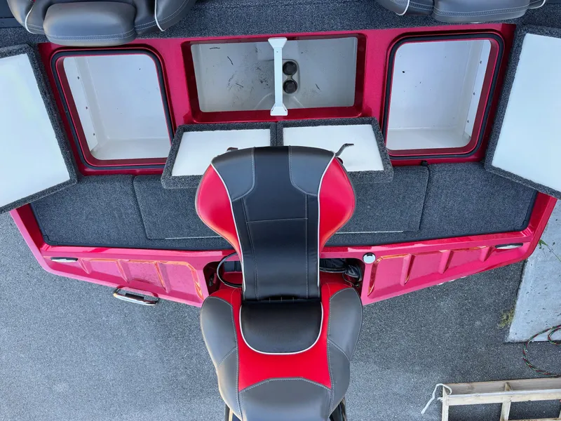 Slide: The Image of 2020 Ranger Z185 boat interior with red and black seating and storage compartments. - 12