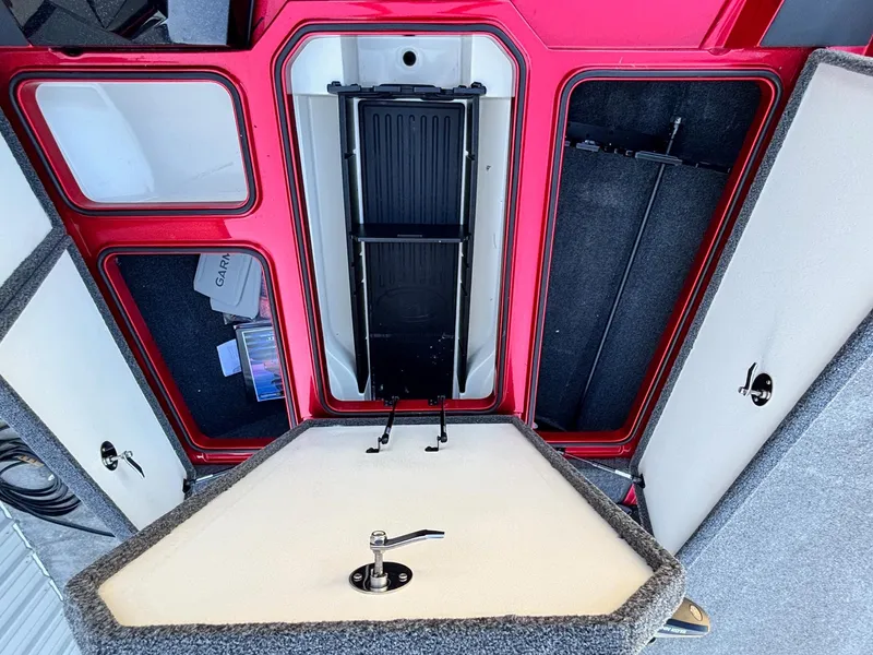 Slide: The Image of 2020 Ranger Z185 boat storage compartments with open lids, showcasing interior organization. - 6