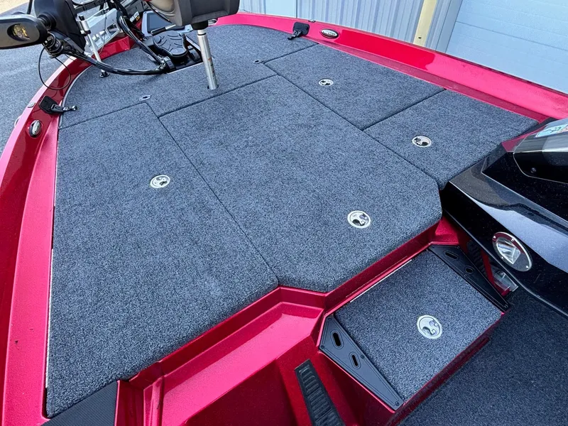 Slide: The Image of 2020 Ranger Z185 boat deck with gray carpet and storage compartments. - 7