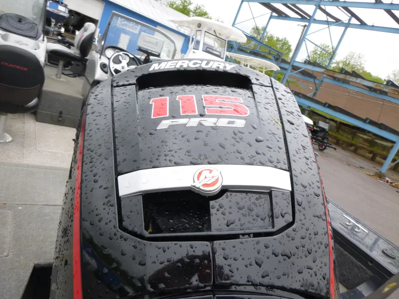 Slide: The Image of Rain-soaked Mercury 115 Pro outboard motor on 2011 Tracker Targa V-18 WT boat. - 11