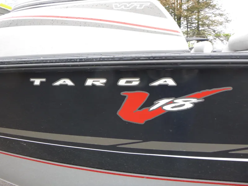 Slide: The Image of 2011 Tracker Targa V-18 WT boat with bold logo and sleek design. - 12