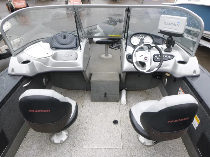 Slide: The Image of 2011 Tracker Targa V-18 WT boat interior with steering wheel and Garmin GPS. - 6