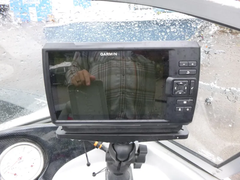 Slide: The Image of Garmin GPS device on 2011 Tracker Targa V-18 WT boat dashboard, with raindrops on windshield. - 9