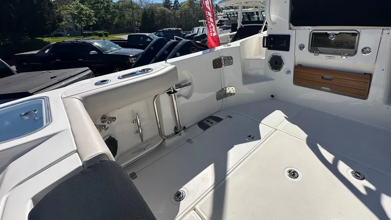 Slide: The Image of 2025 Boston Whaler 405 Conquest boat interior with seating and storage compartments. - 10