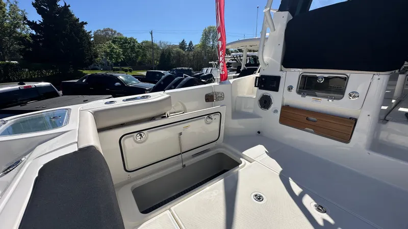 Slide: The Image of 2025 Boston Whaler 405 Conquest boat interior, featuring seating and storage compartments. - 11