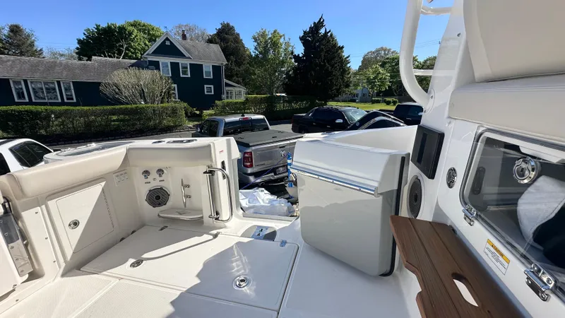 Slide: The Image of 2025 Boston Whaler 405 Conquest boat interior with modern amenities and outdoor view. - 13