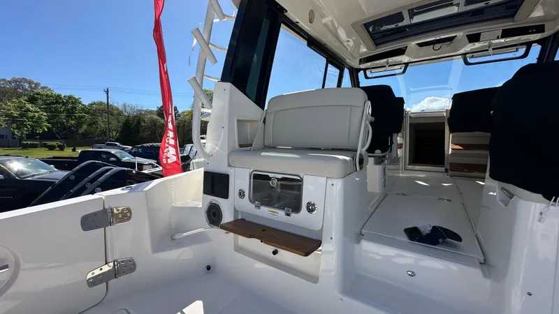 Slide: The Image of 2025 Boston Whaler 405 Conquest interior with seating and modern amenities. - 20
