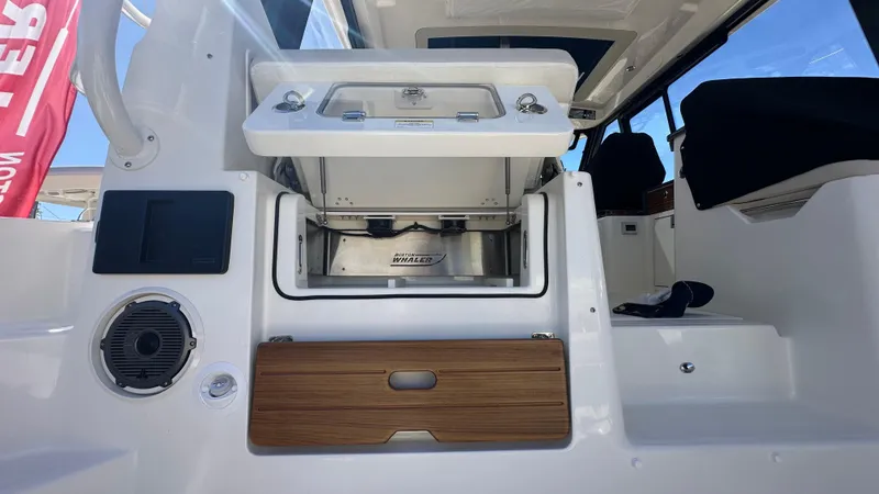 Slide: The Image of 2025 Boston Whaler 405 Conquest interior with modern amenities and sleek design. - 21