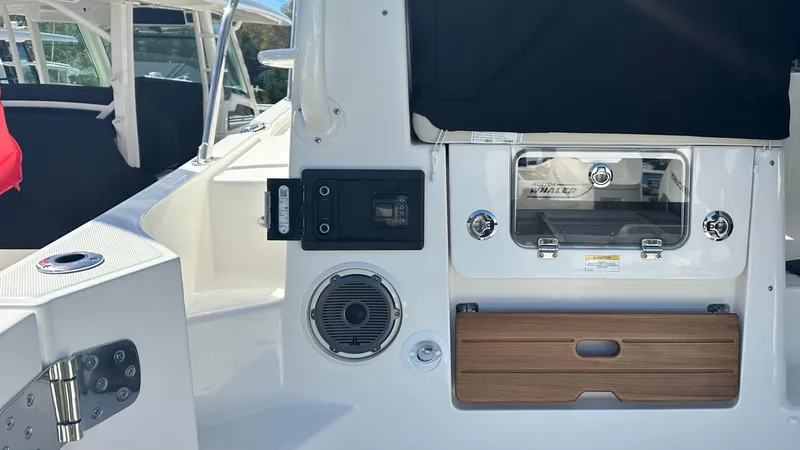 Slide: The Image of 2025 Boston Whaler 405 Conquest boat interior with speaker and control panel. - 22
