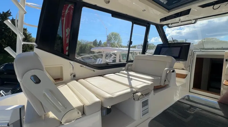 Slide: The Image of Interior of 2025 Boston Whaler 405 Conquest with luxurious seating and modern design. - 27