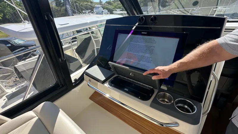 Slide: The Image of Interior of 2025 Boston Whaler 405 Conquest with advanced navigation system. - 31