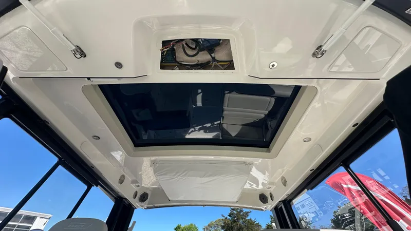Slide: The Image of 2025 Boston Whaler 405 Conquest cabin roof with skylight and modern design. - 39