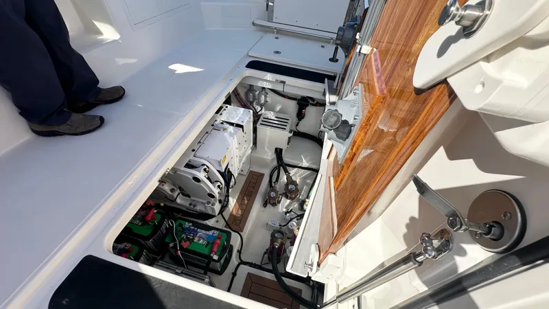 Slide: The Image of Engine compartment of 2025 Boston Whaler 405 Conquest boat, showcasing mechanical components. - 8