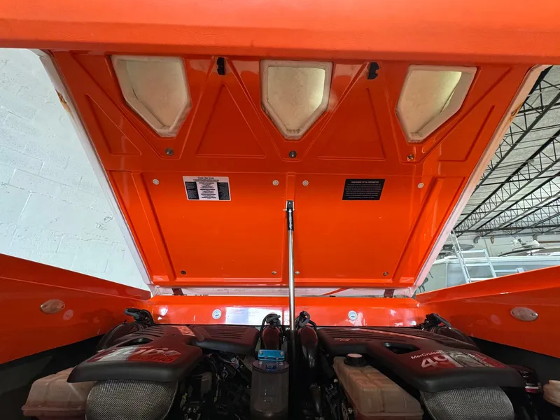 Slide: The Image of 2007 Baja 35 Outlaw engine compartment with open orange hatch, showcasing dual engines. - 12