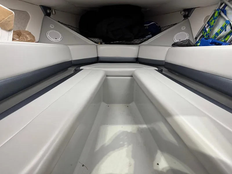 Slide: The Image of 2007 Baja 35 Outlaw cabin interior with cushioned seating and storage compartments. - 23